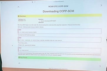 Students discussing an instructional slide